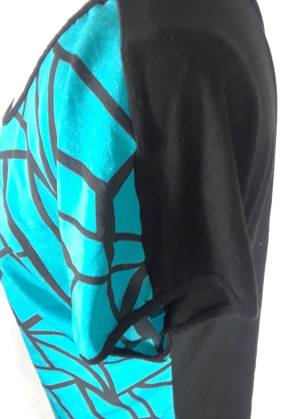 TA1-22 Espresso Women’s XL Blouse in black with blue geometric patterns in front