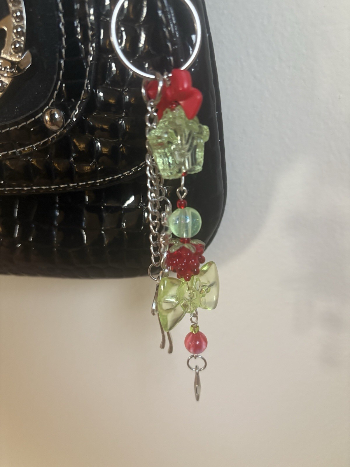 Handmade Raspberry themed acrylic beaded silver bow accented keychain