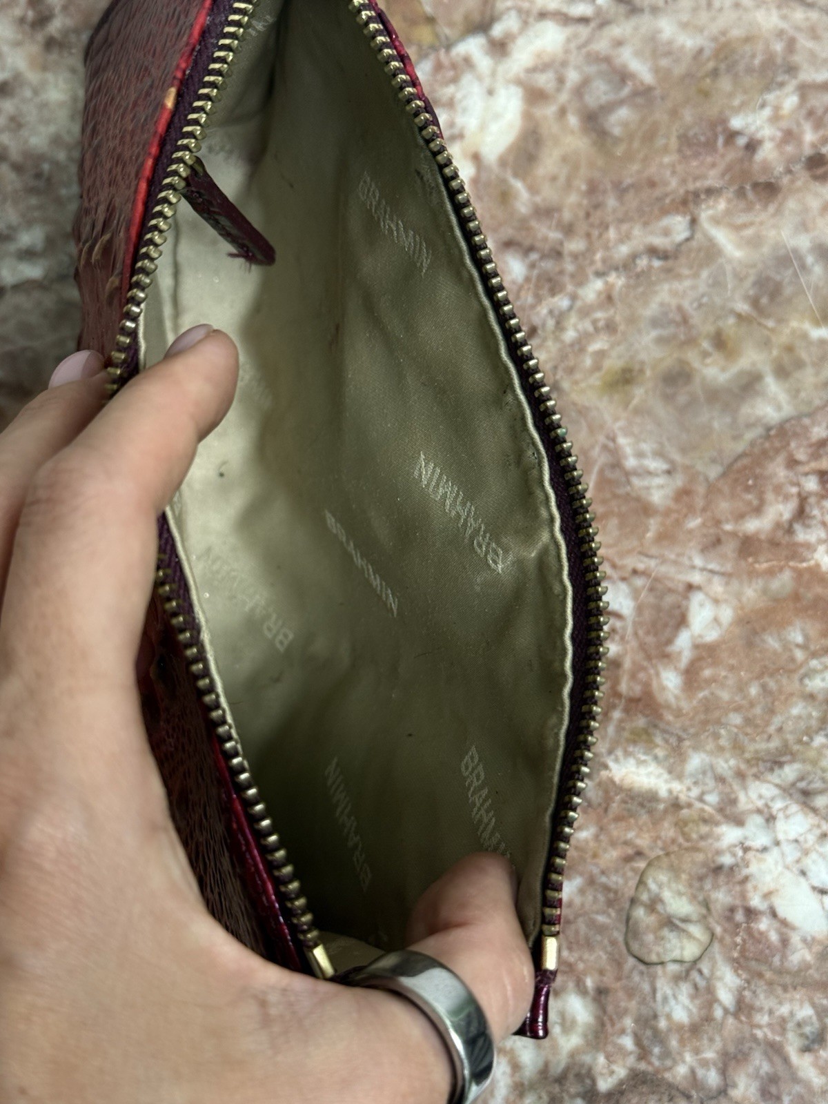 Brahmin Melbourne Daisy wristlet in an red and purple ombre crocodile leather
