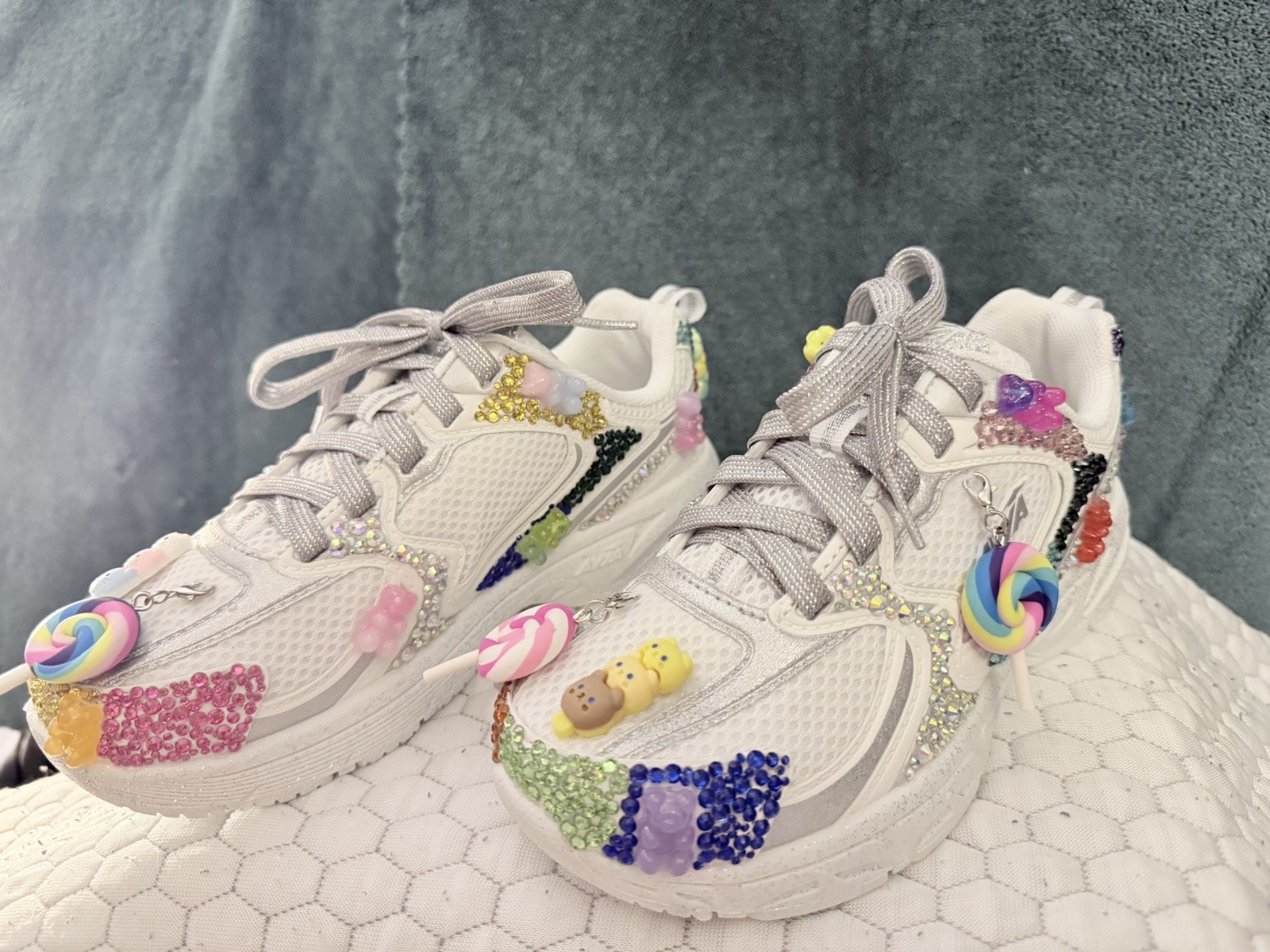 Hand-customized white Avia sneakers with silver laces. Shoe size is 1.