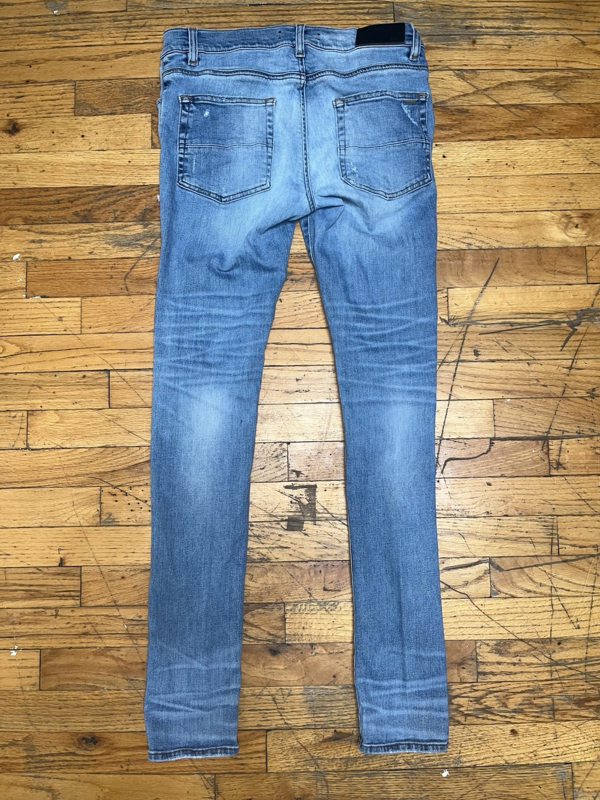 AMIRI Men’s Light Wash Distressed Skinny Slim Fit Blue Denim Jeans