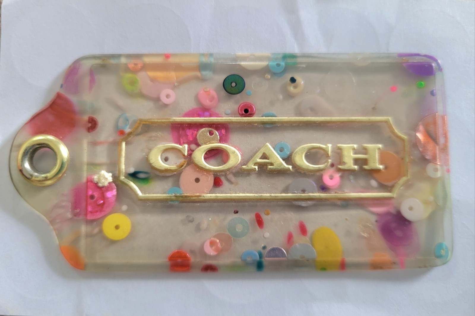 COACH Poppy multicolor confetti shaker hangtag