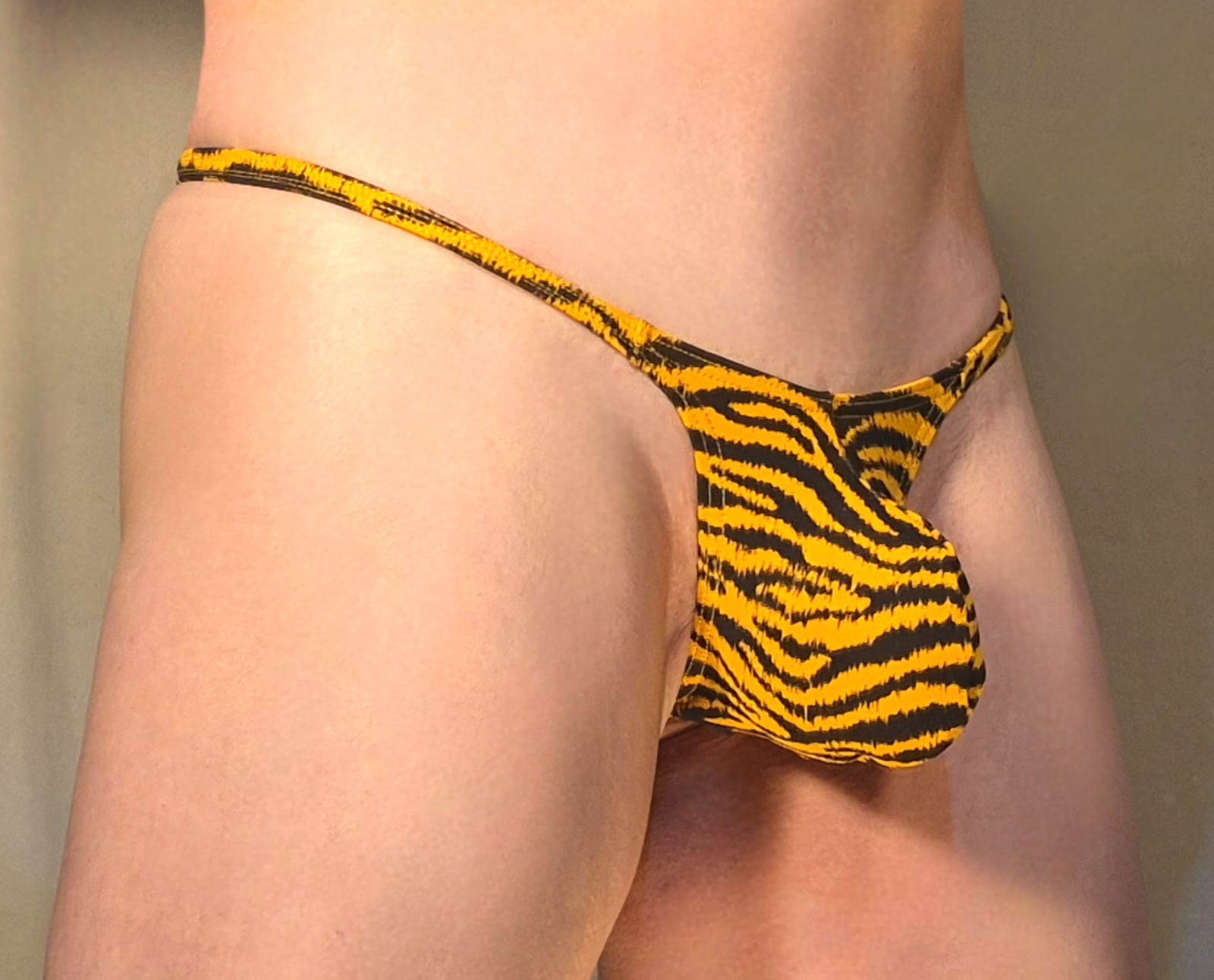 JAXFSTK MENS GRAPE SMUGGLER THONG (M-28-34) ORANGE TIGER STRIPE
