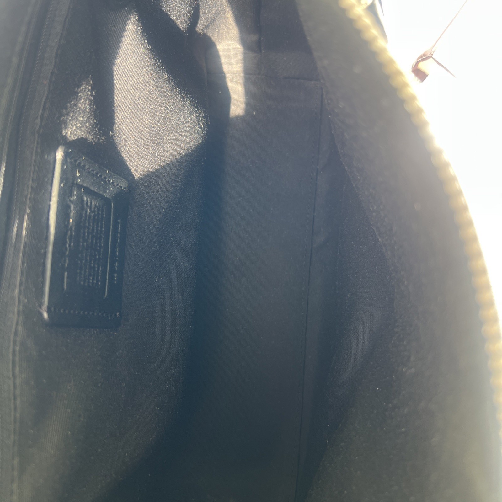 Coach Crossbody Bag Black Pebble Leather black Interior with silver hardware.