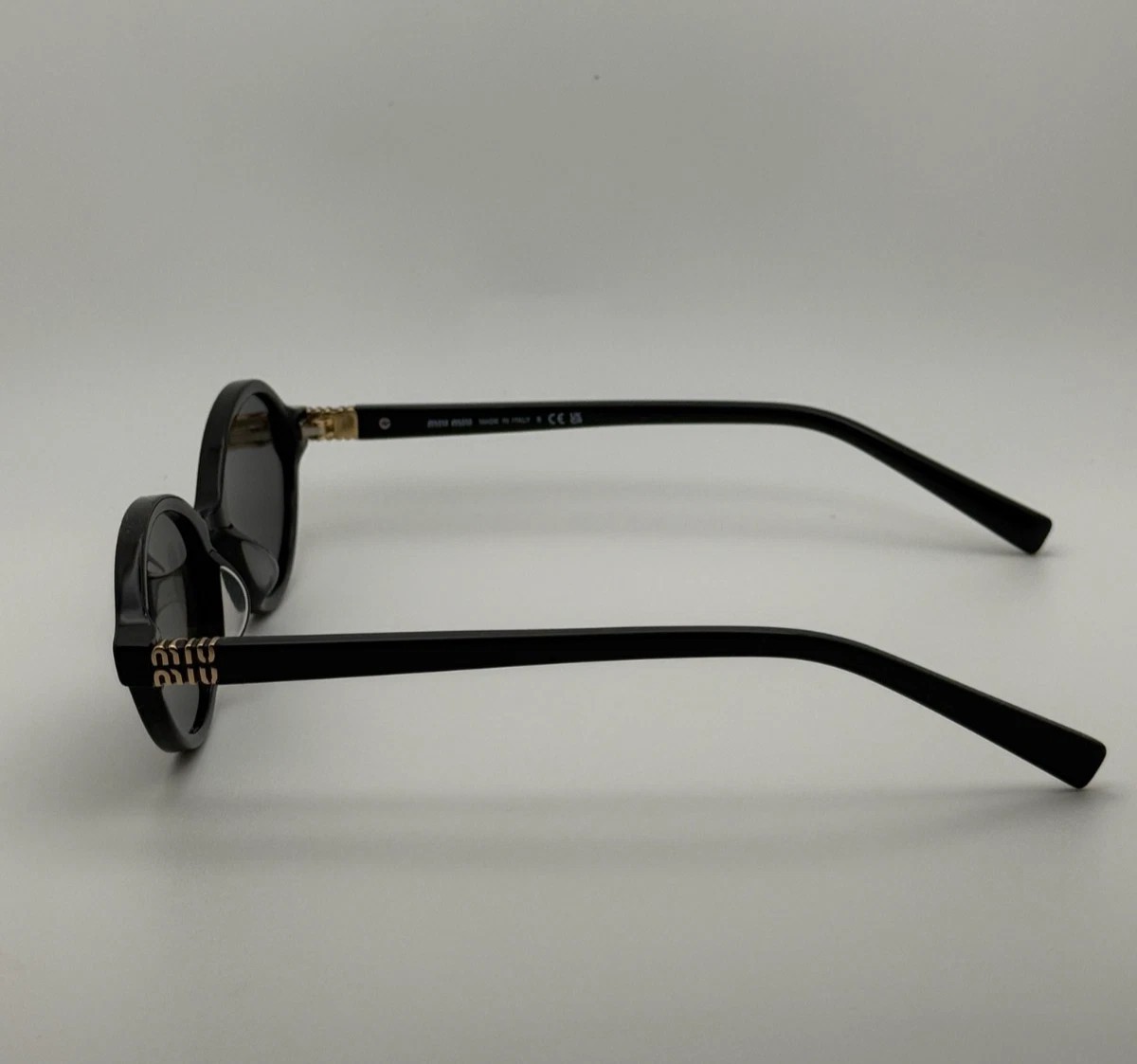 Miu Miu MU04ZS Round Oval Women’s Sunglasses Black Frame Dark Lenses