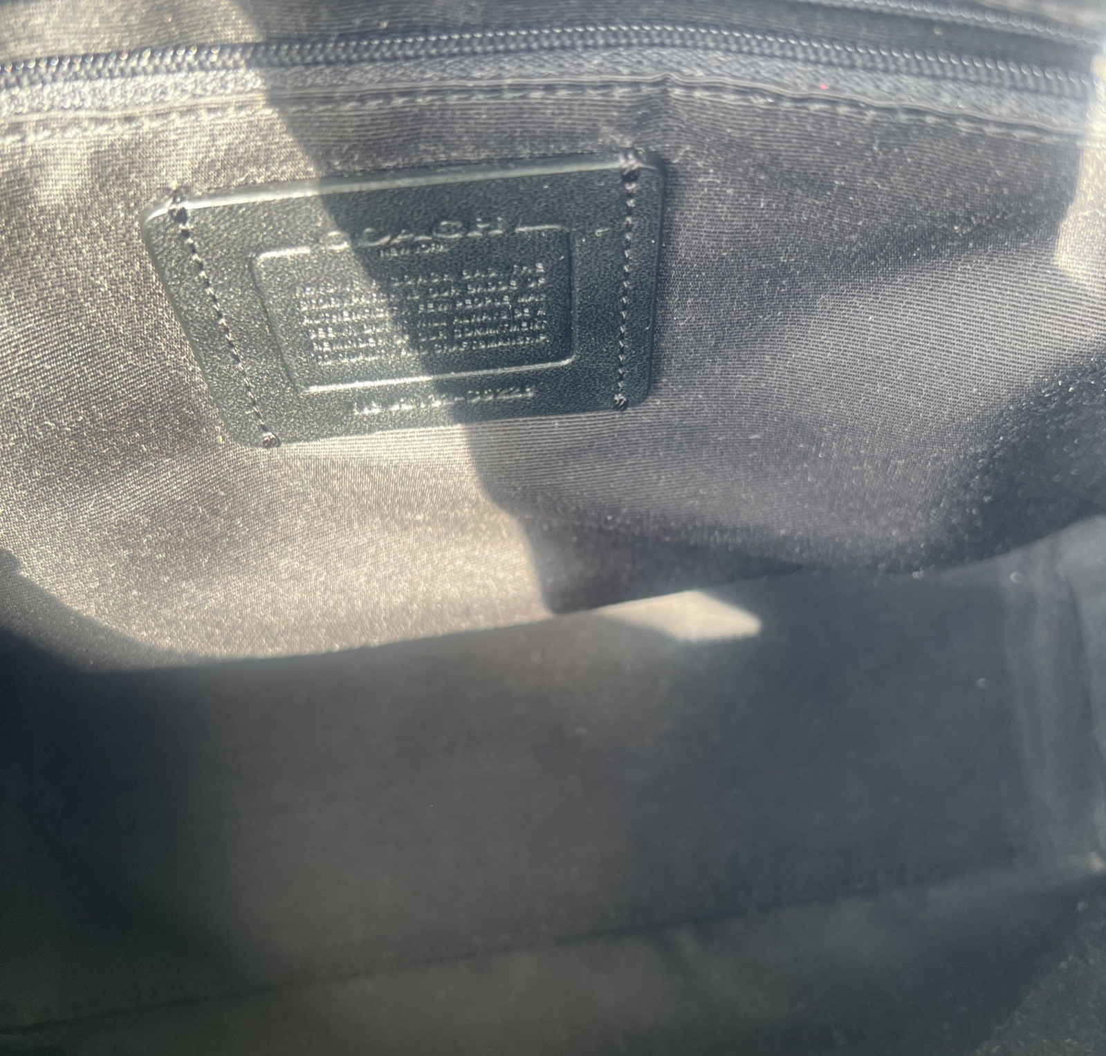 Coach Crossbody Bag Black Pebble Leather black Interior with silver hardware.