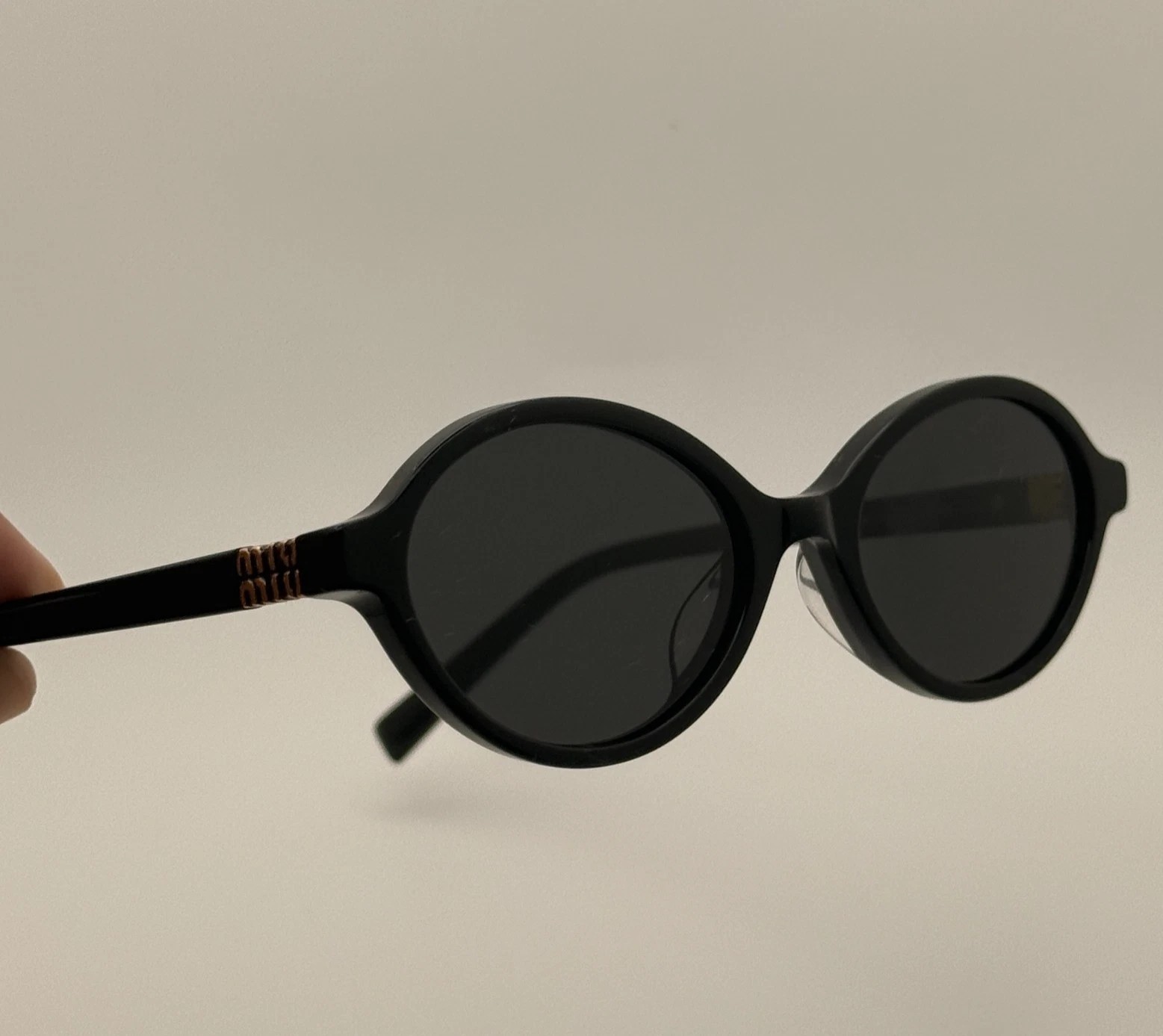 Miu Miu MU04ZS Round Oval Women’s Sunglasses Black Frame Dark Lenses
