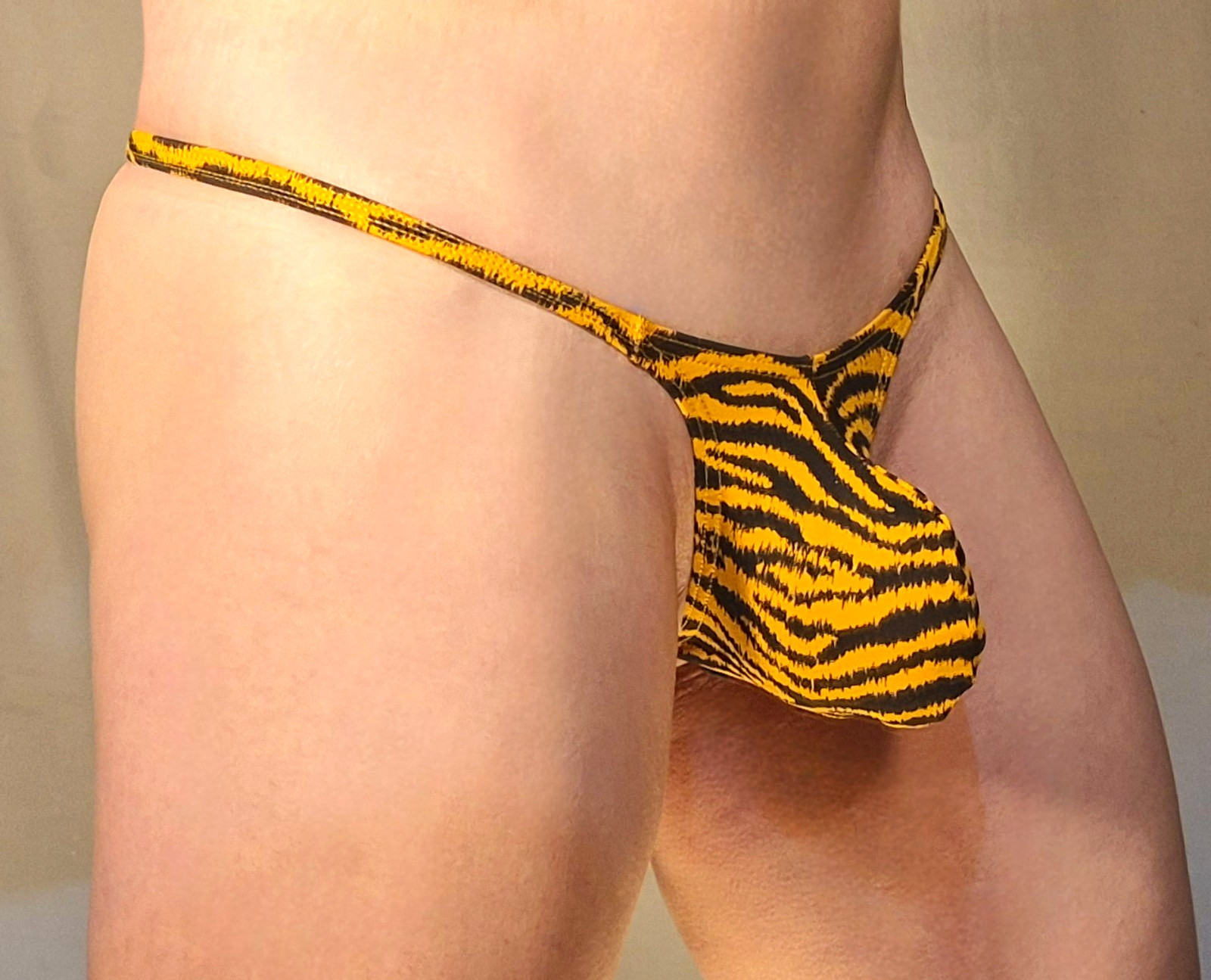 JAXFSTK MENS GRAPE SMUGGLER THONG (M-28-34) ORANGE TIGER STRIPE