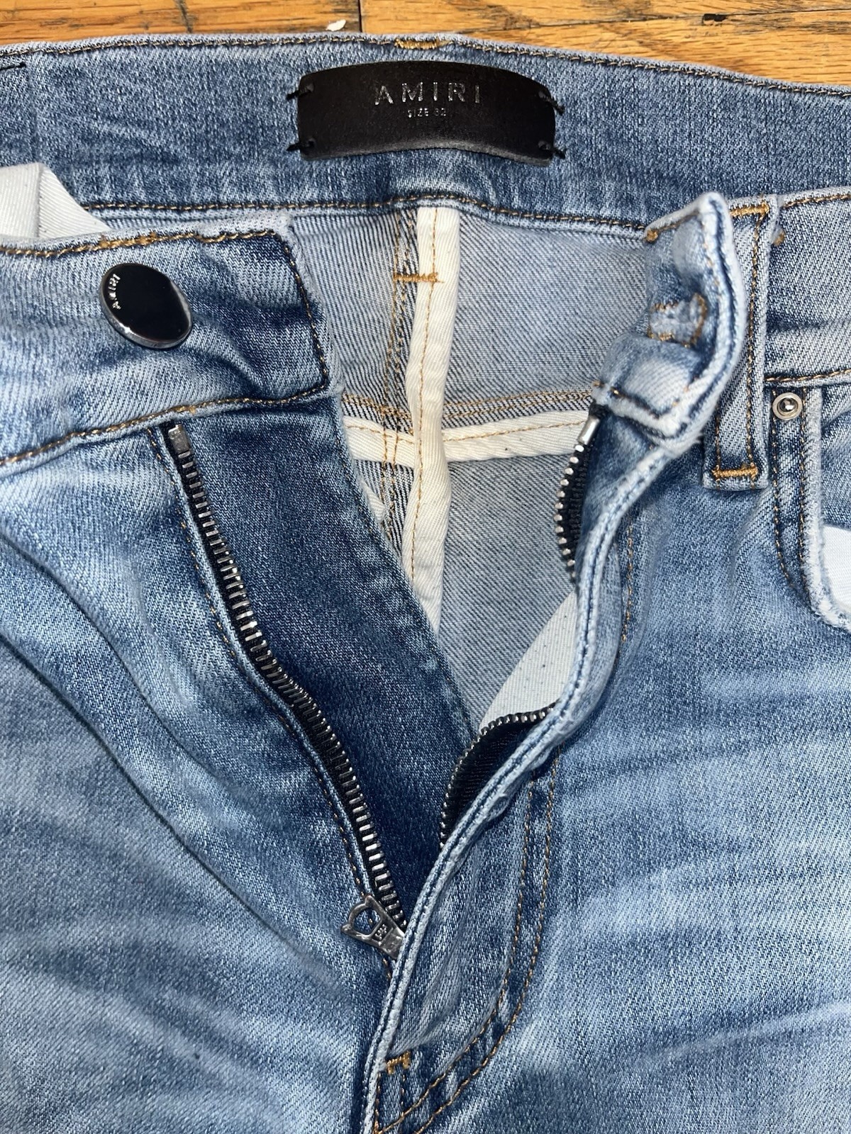 AMIRI Men’s Light Wash Distressed Skinny Slim Fit Blue Denim Jeans