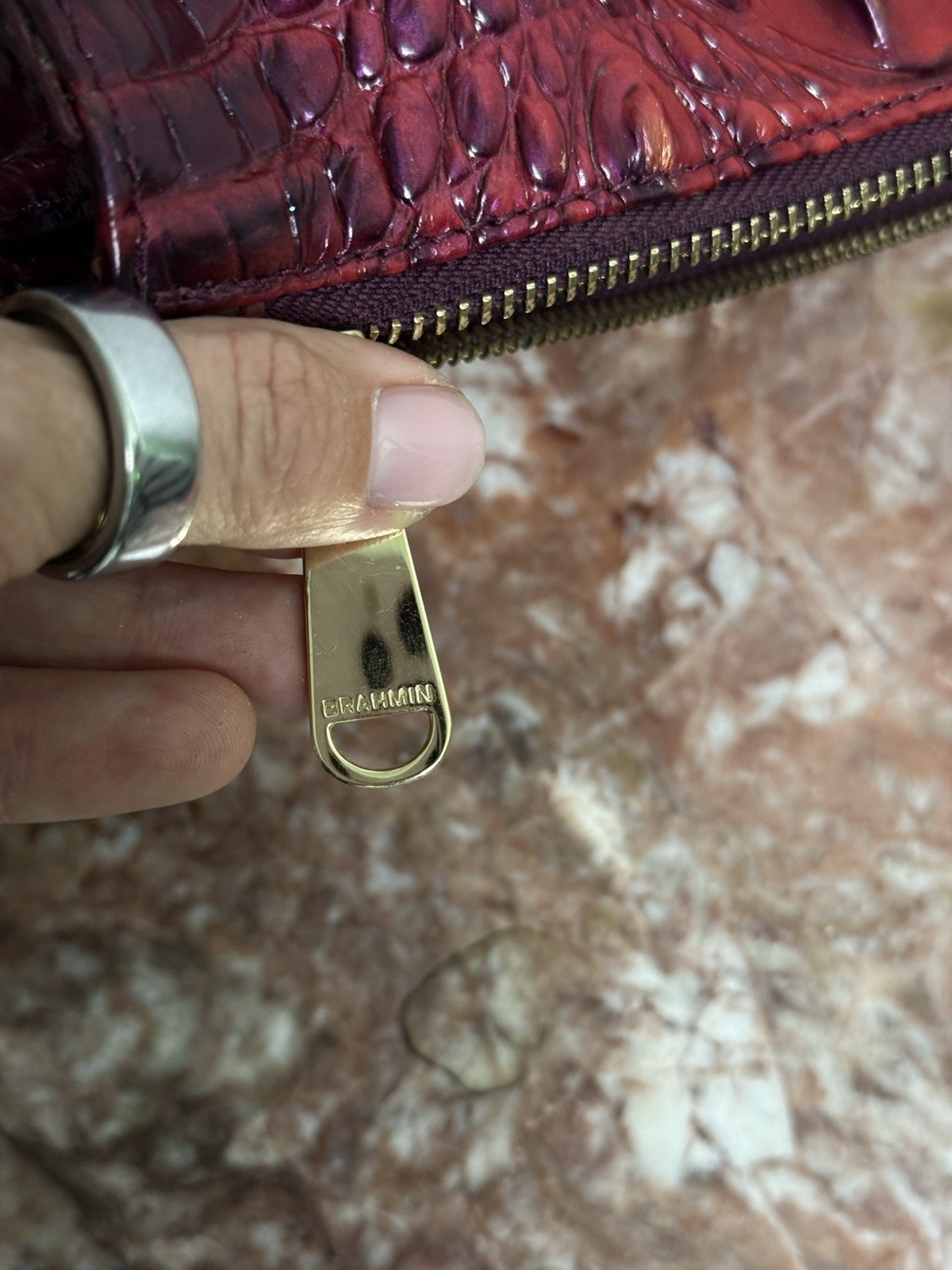 Brahmin Melbourne Daisy wristlet in an red and purple ombre crocodile leather