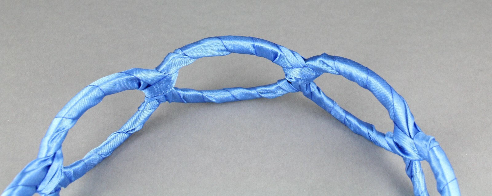 Aqua satin wrapped fabric 1 3/8″ wide headband oval chain link cut out pattern