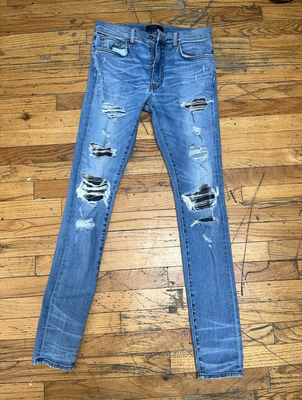 AMIRI Men’s Light Wash Distressed Skinny Slim Fit Blue Denim Jeans