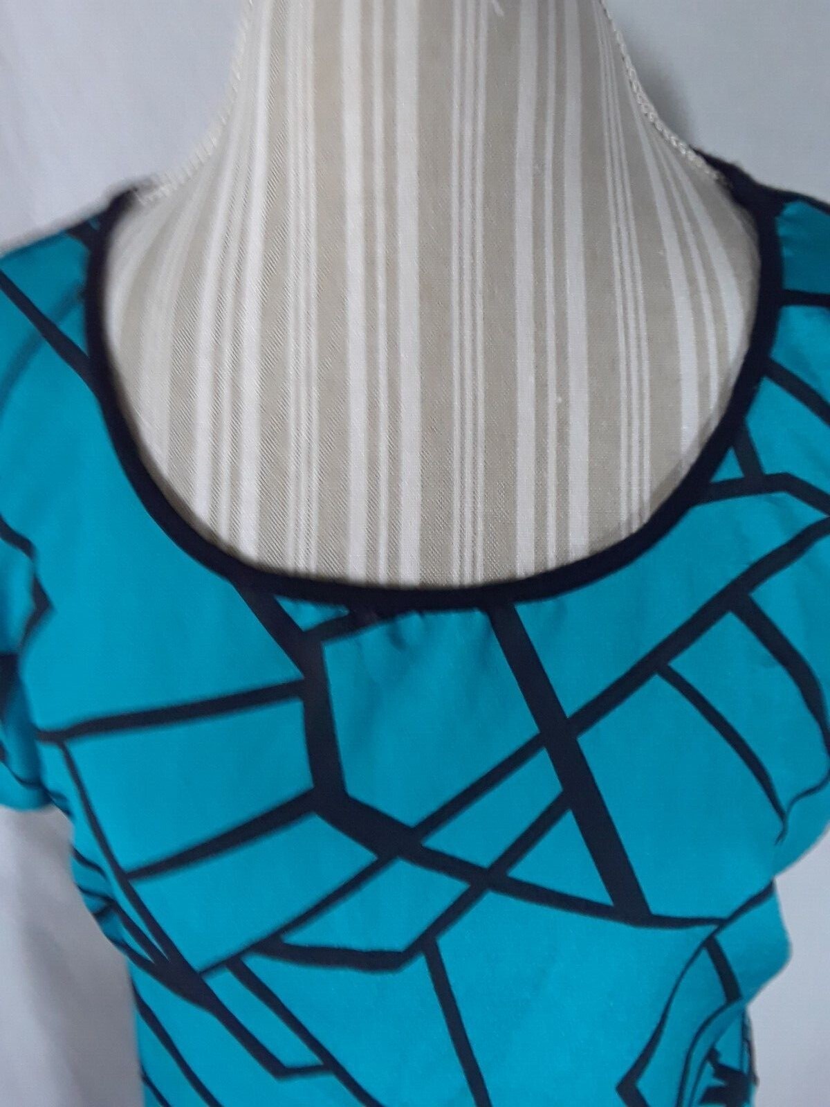 TA1-22 Espresso Women’s XL Blouse in black with blue geometric patterns in front