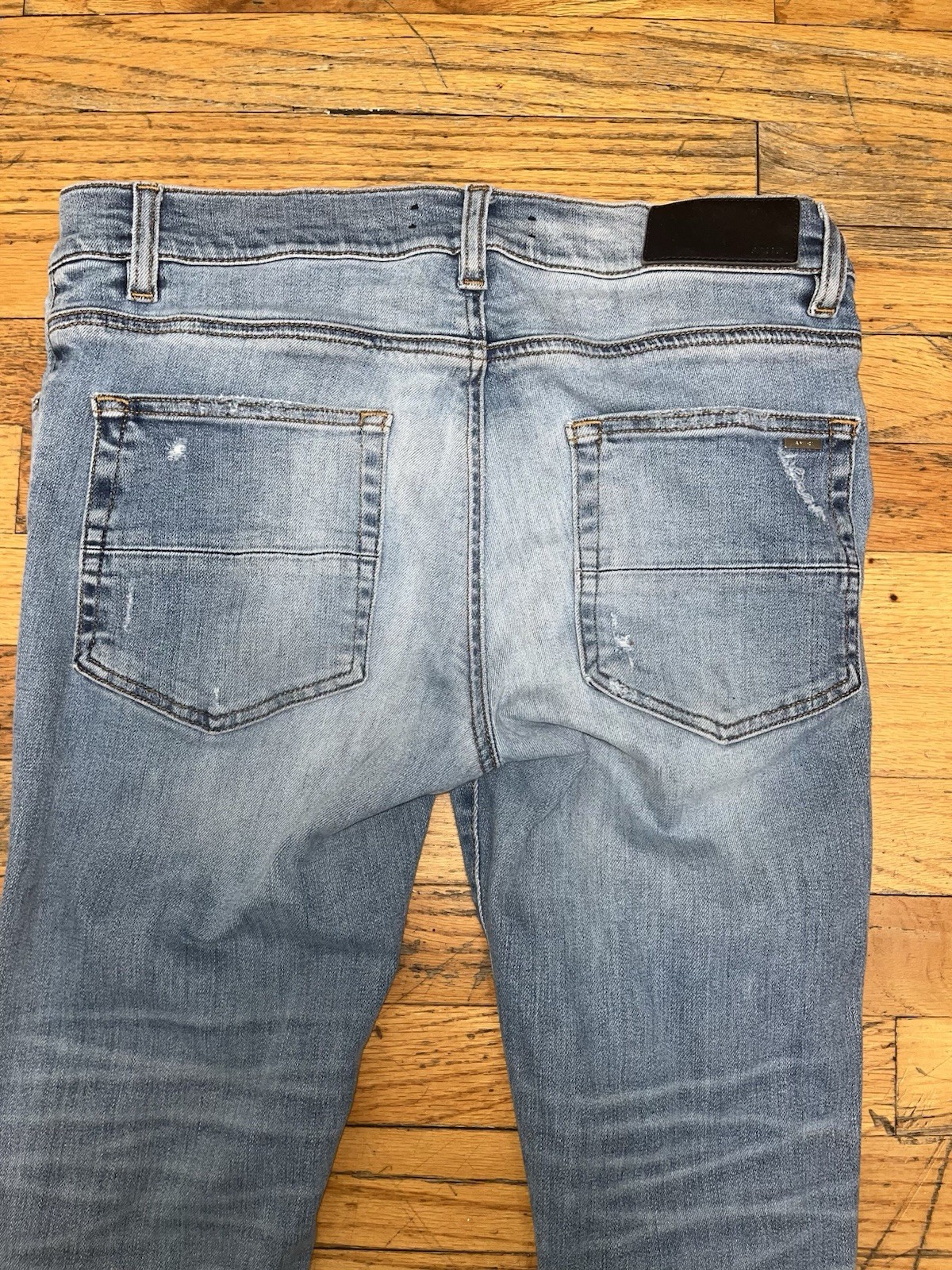 AMIRI Men’s Light Wash Distressed Skinny Slim Fit Blue Denim Jeans