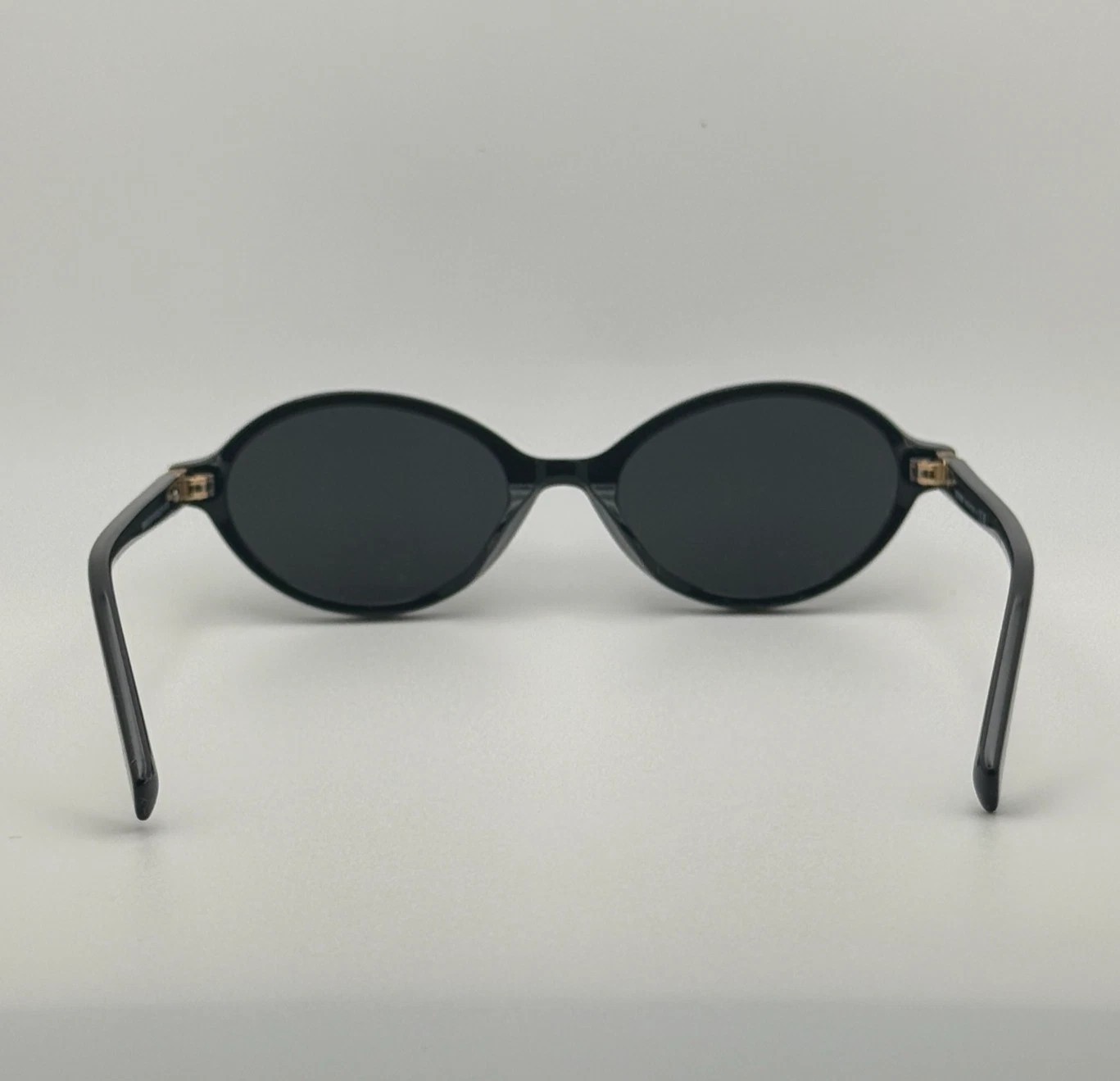 Miu Miu MU04ZS Round Oval Women’s Sunglasses Black Frame Dark Lenses