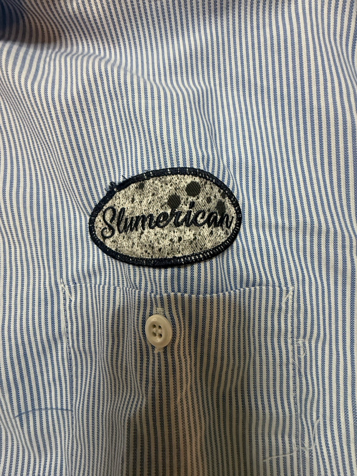 Slumerican Shirt Bundle… 13 Shirts Most Are Large Some Are Xl.