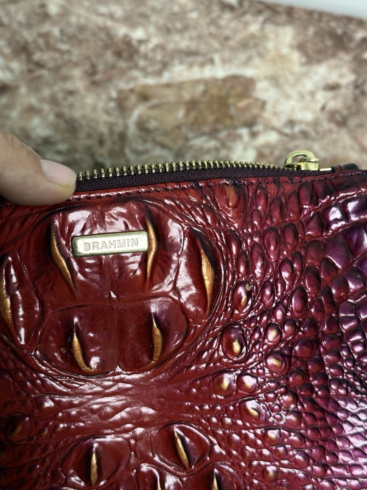Brahmin Melbourne Daisy wristlet in an red and purple ombre crocodile leather