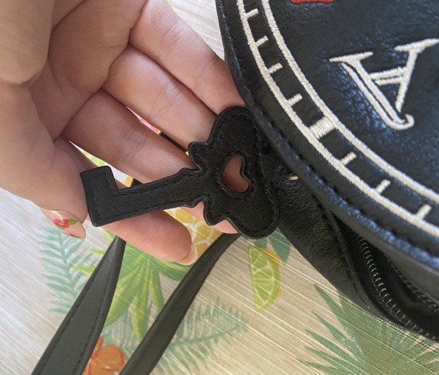Danielle Nicole Alice in Wonderland Round Small Black Crossbody Zip Bag Clock