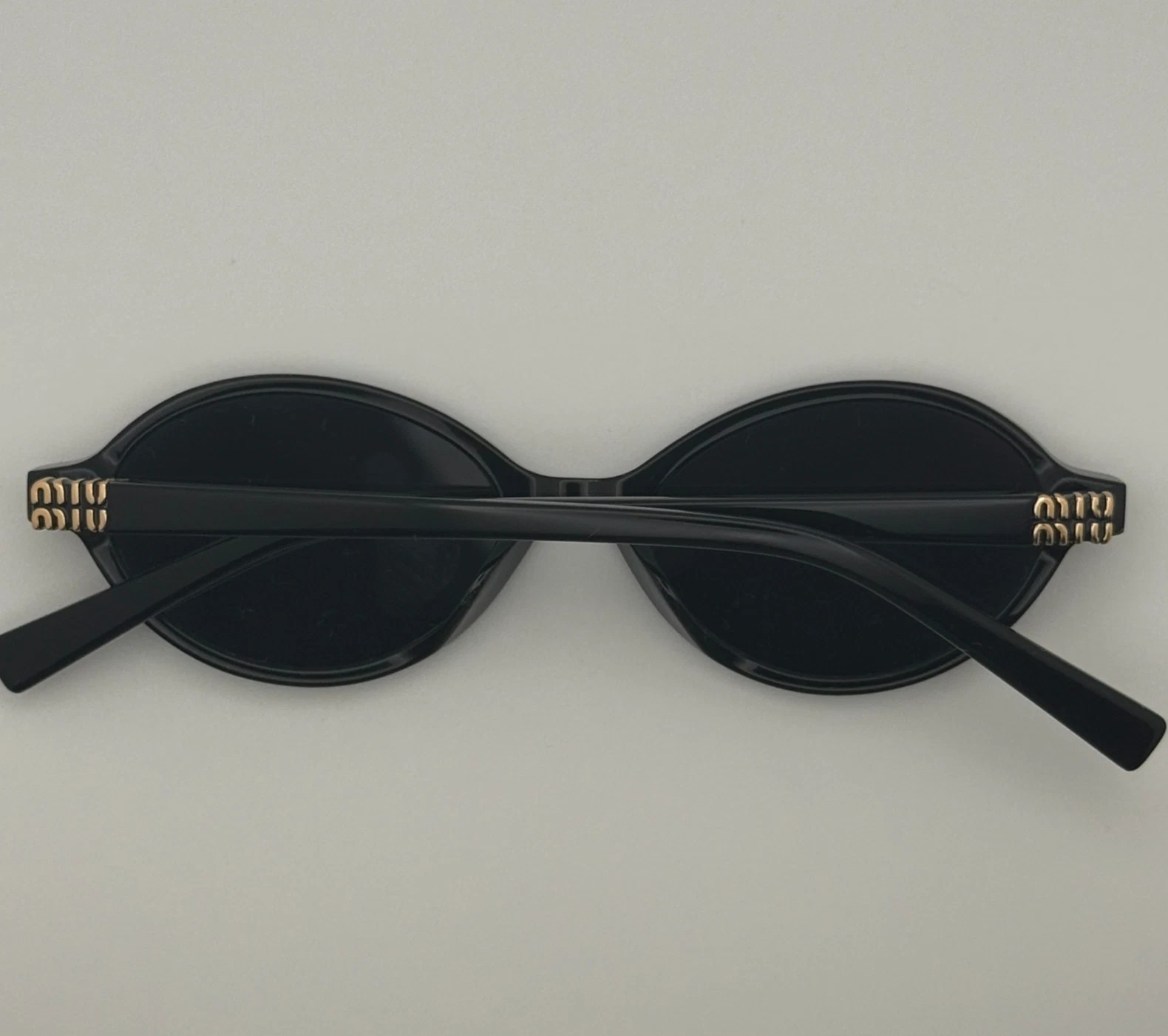 Miu Miu MU04ZS Round Oval Women’s Sunglasses Black Frame Dark Lenses