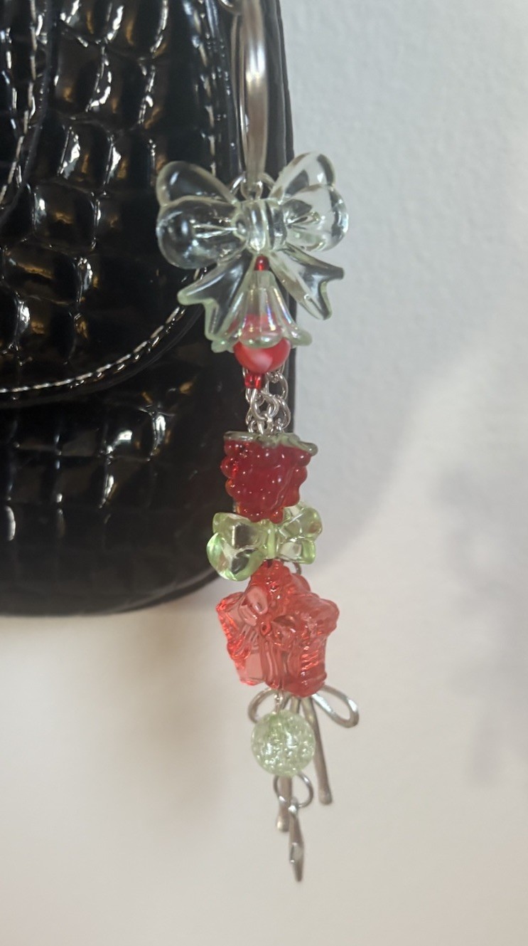 Handmade raspberry themed acrylic beaded with silver bow accented keychain