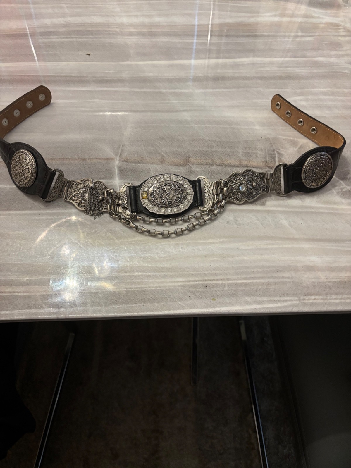 Medallion belt Black leather-like belt with beautiful silver medallions.