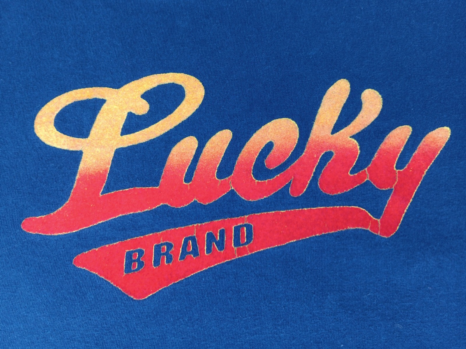 Vintage 90s Lucky Brand Knit Wear Men’s Large T-shirt Flocked Spell Out Navy USA