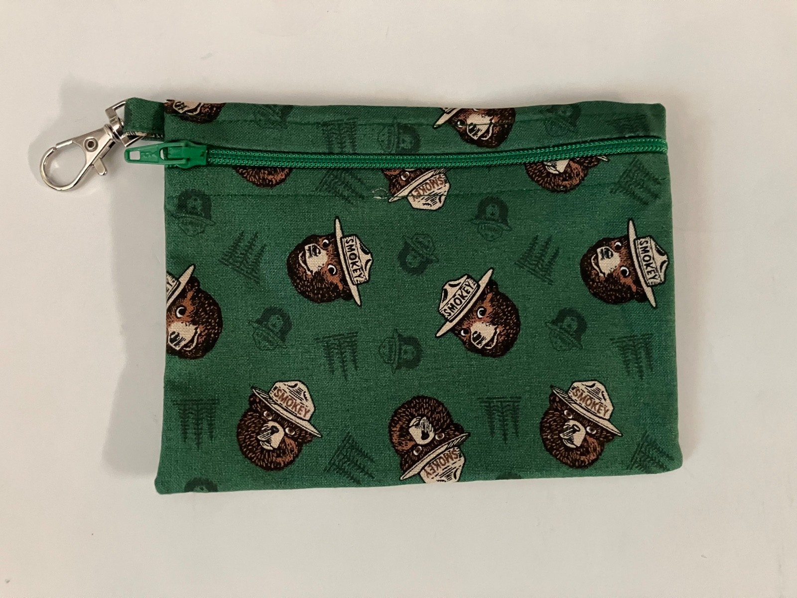 Smokey The Bear Green background small zippered bag