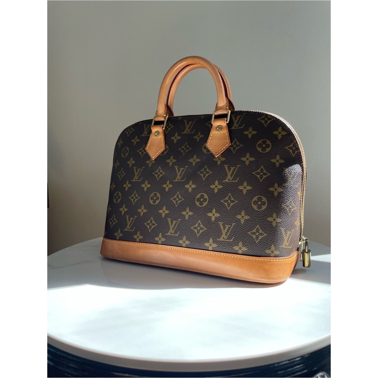 Authentic Louis Vuitton Alma PM handbag in classic Monogram canvas