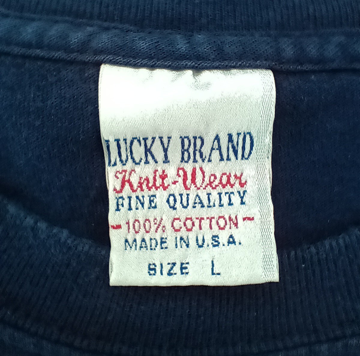 Vintage 90s Lucky Brand Knit Wear Men’s Large T-shirt Flocked Spell Out Navy USA