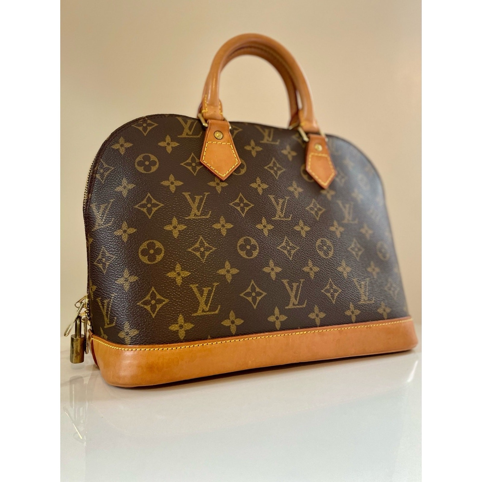 Authentic Louis Vuitton Alma PM handbag in classic Monogram canvas