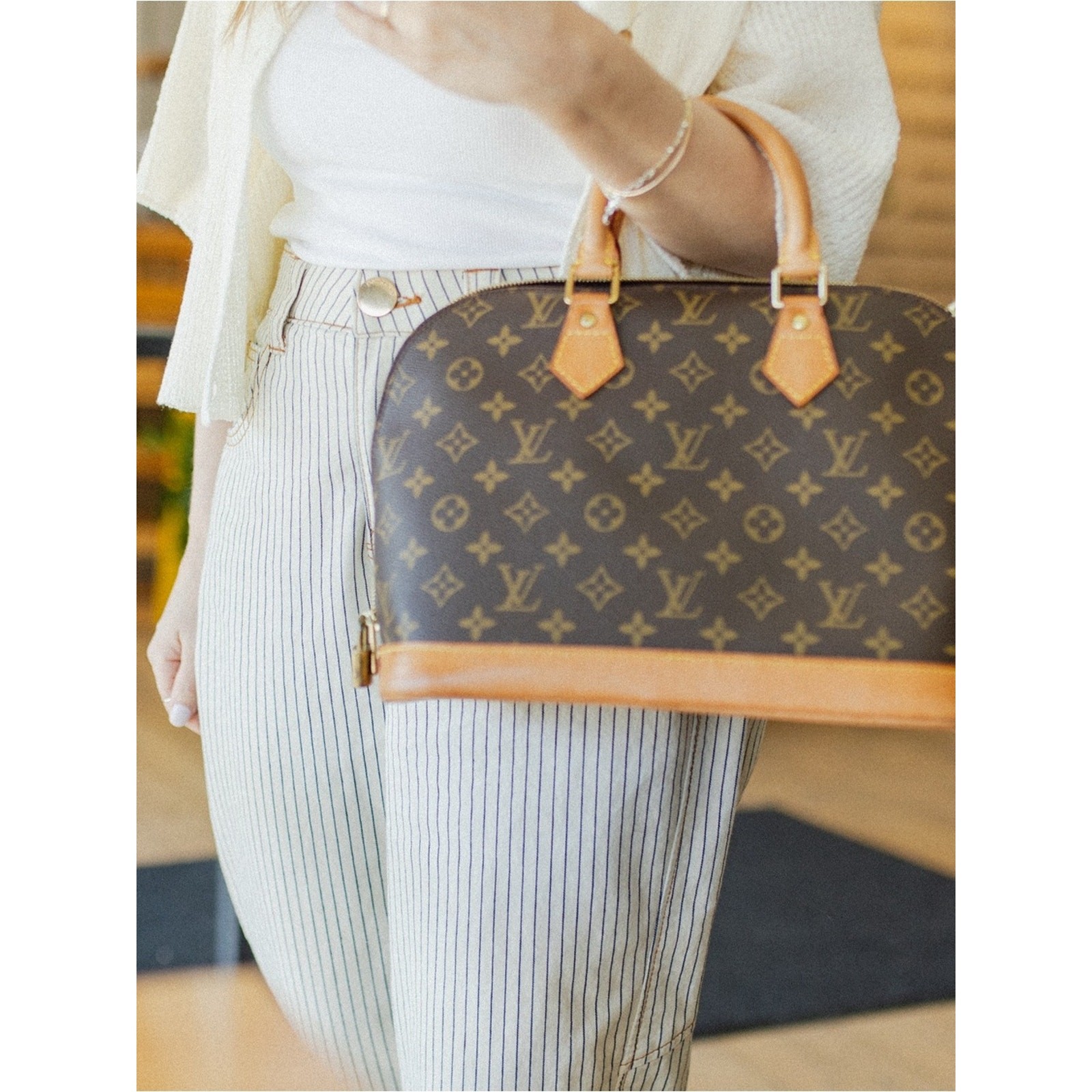 Authentic Louis Vuitton Alma PM handbag in classic Monogram canvas