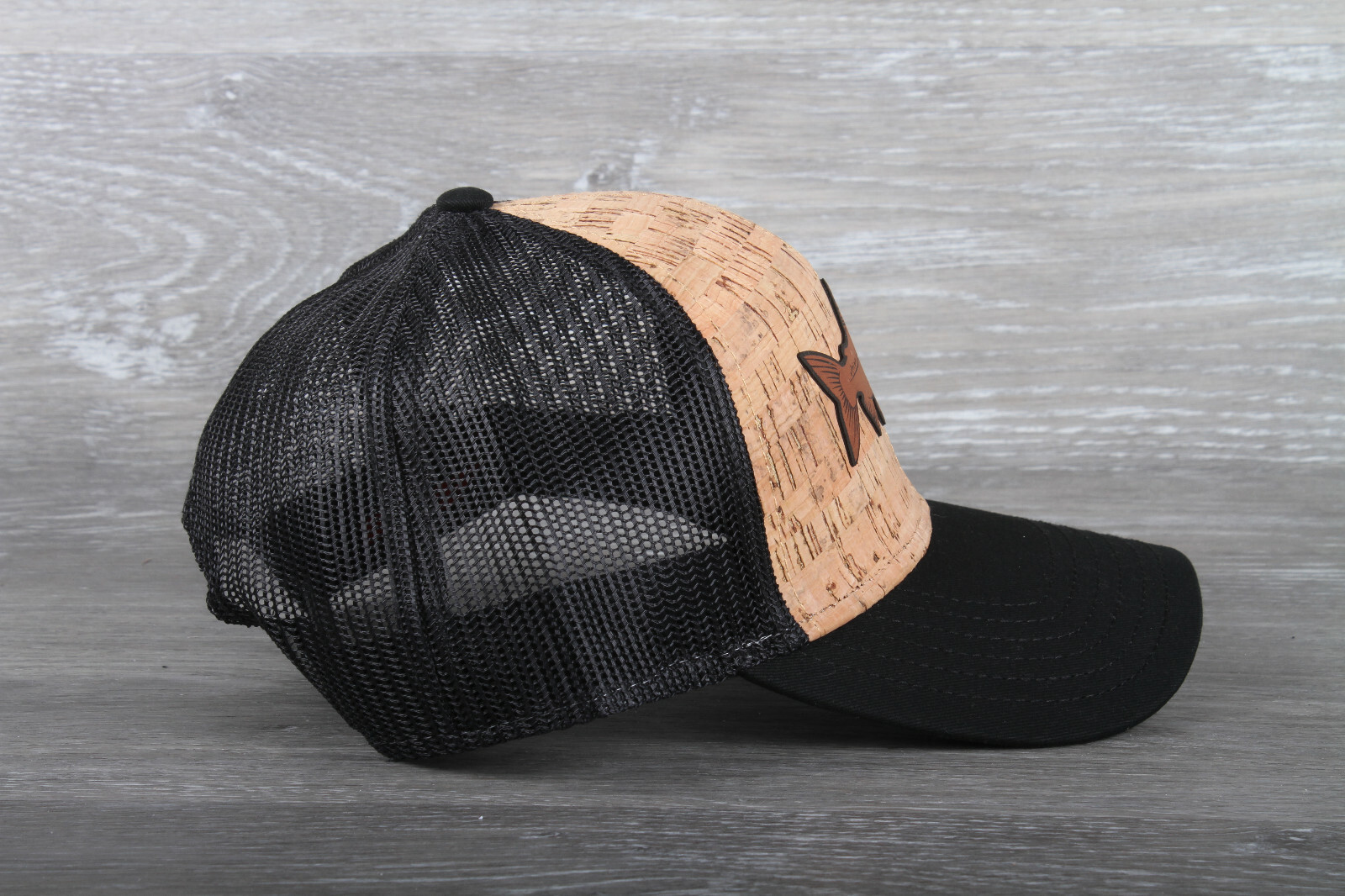 Rainbow trout leather patch on an Otto 6 Panel Cork Mesh Back Hat