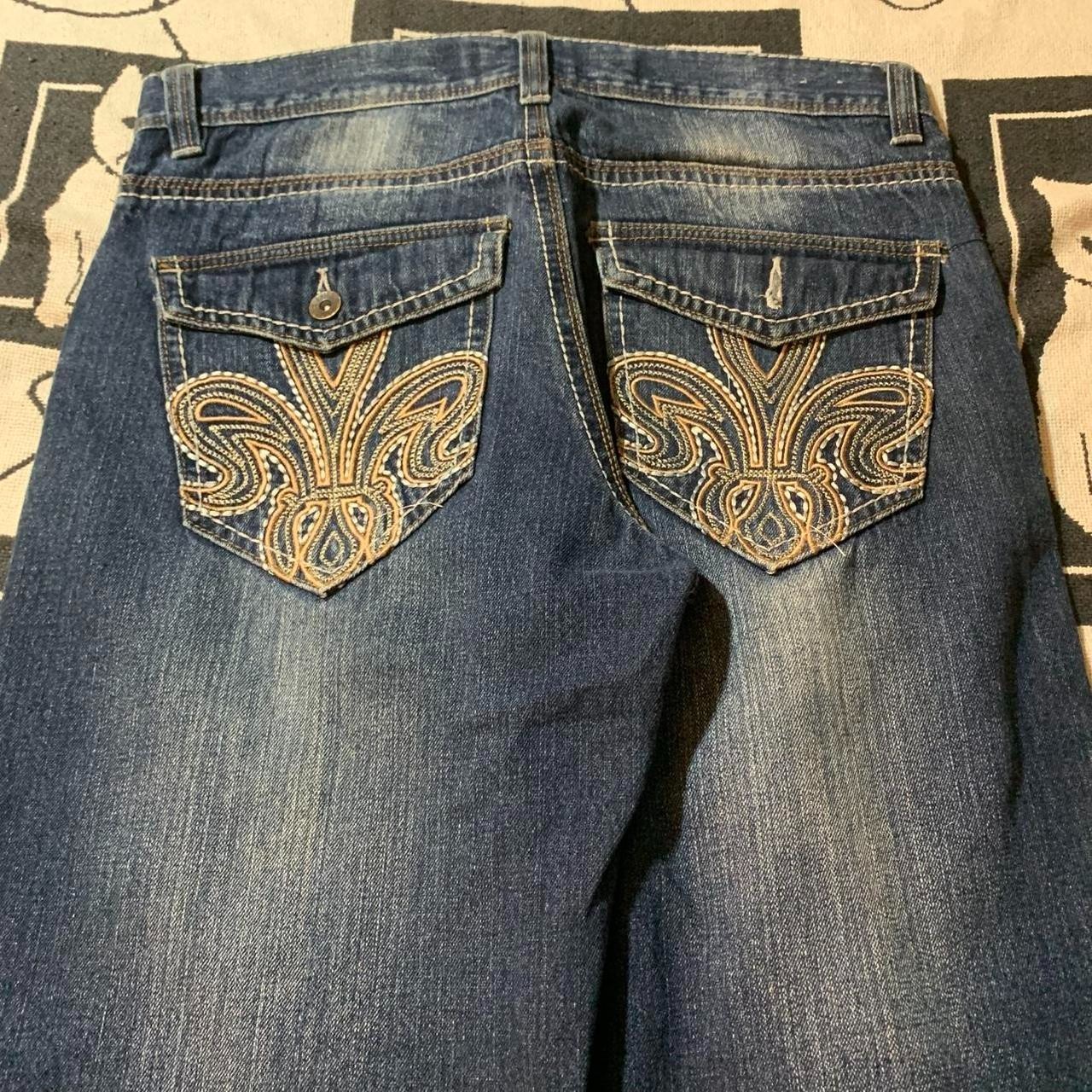 Avirex embroidered jeans with gold embroidered designs on back pockets Size 34