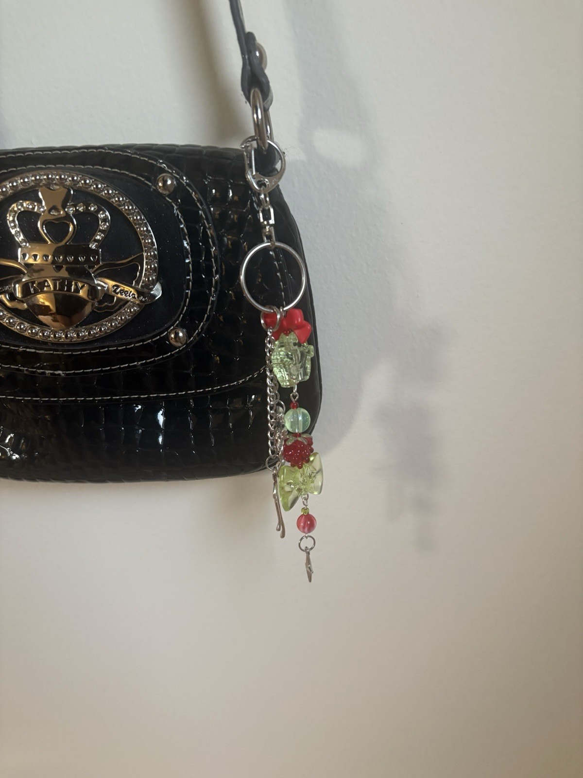 Handmade Raspberry themed acrylic beaded silver bow accented keychain
