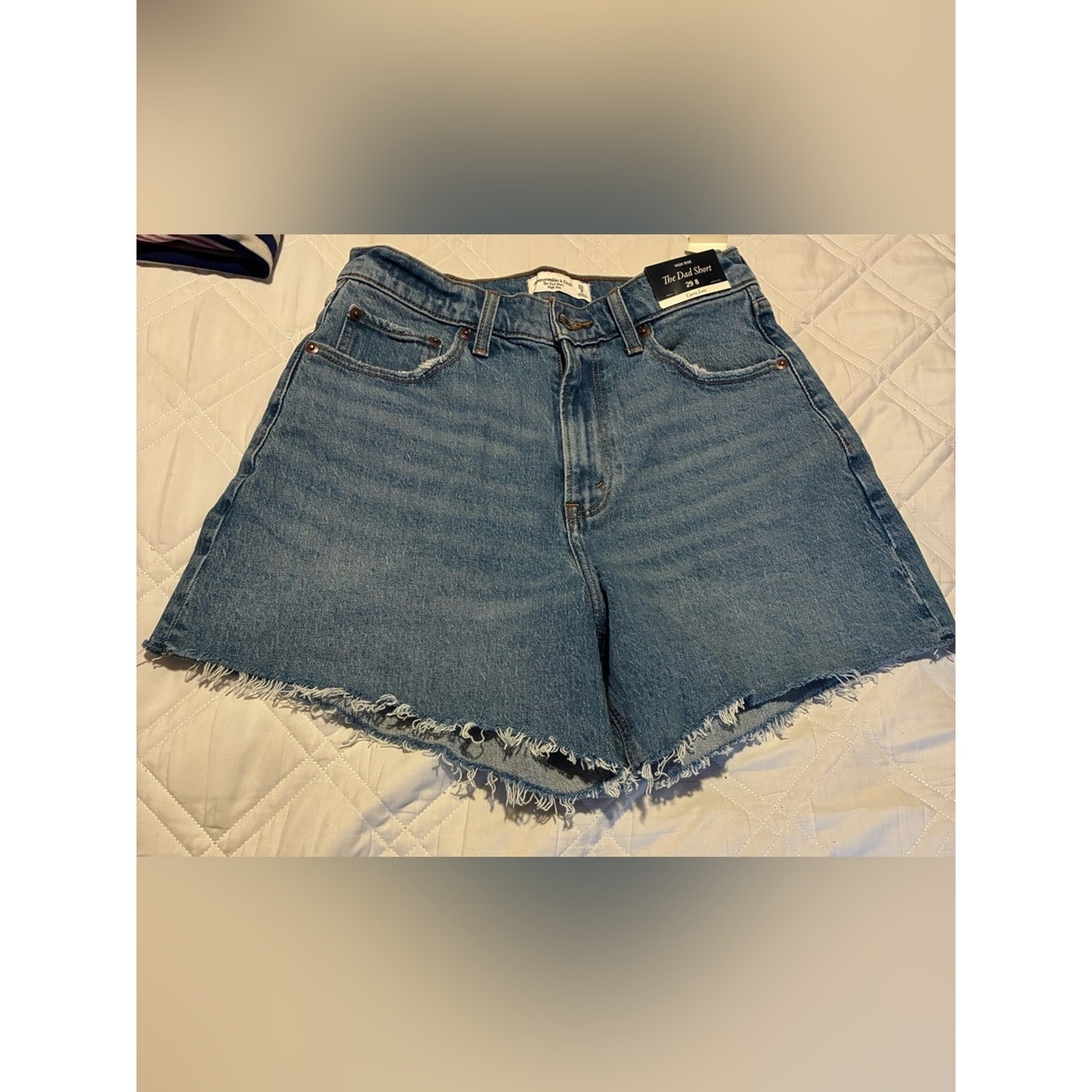 Abercrombie & Fitch “The Dad Short” in a high-rise fit with a raw hem 29/8