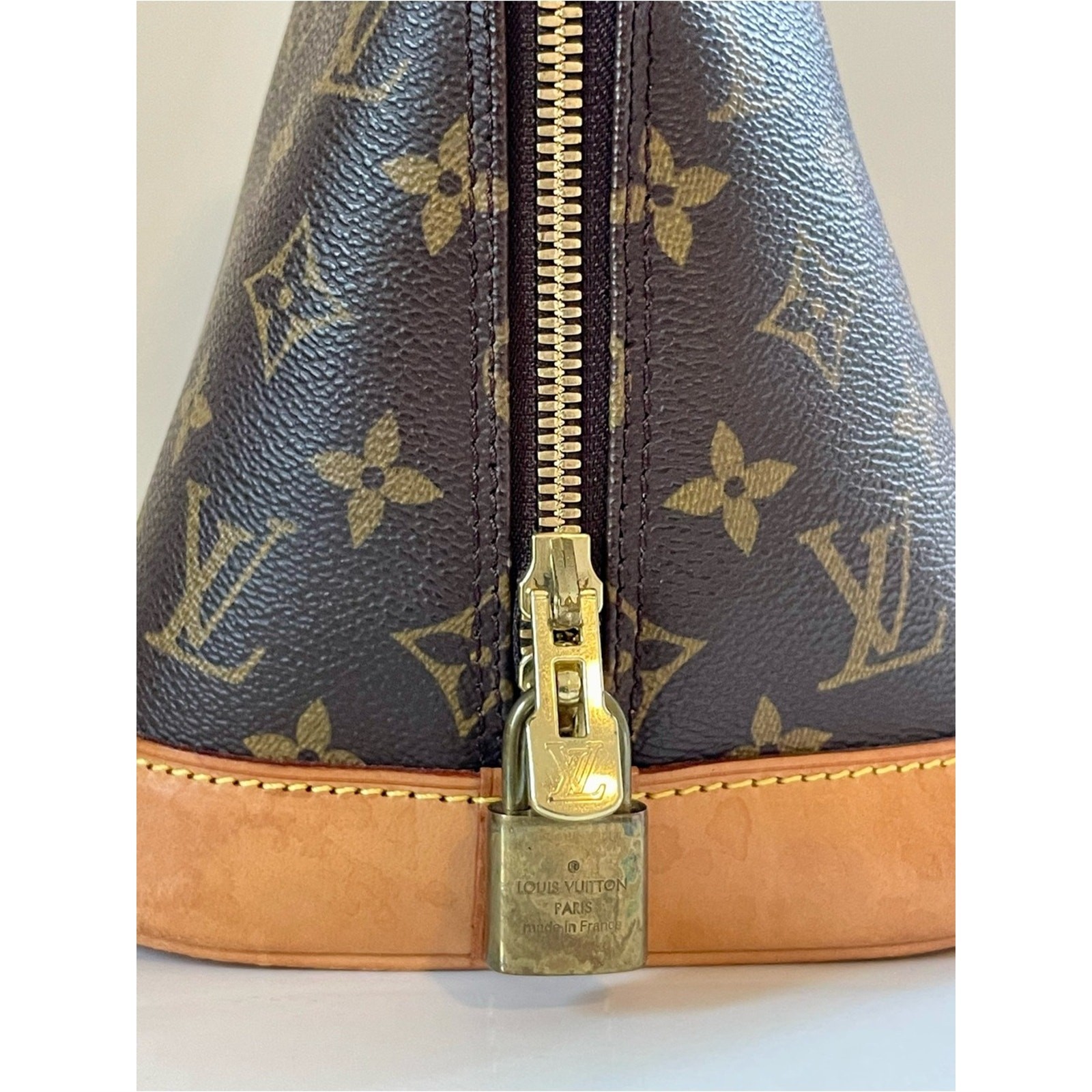 Authentic Louis Vuitton Alma PM handbag in classic Monogram canvas