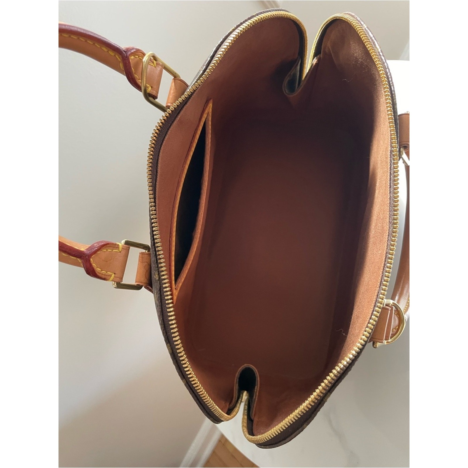 Authentic Louis Vuitton Alma PM handbag in classic Monogram canvas