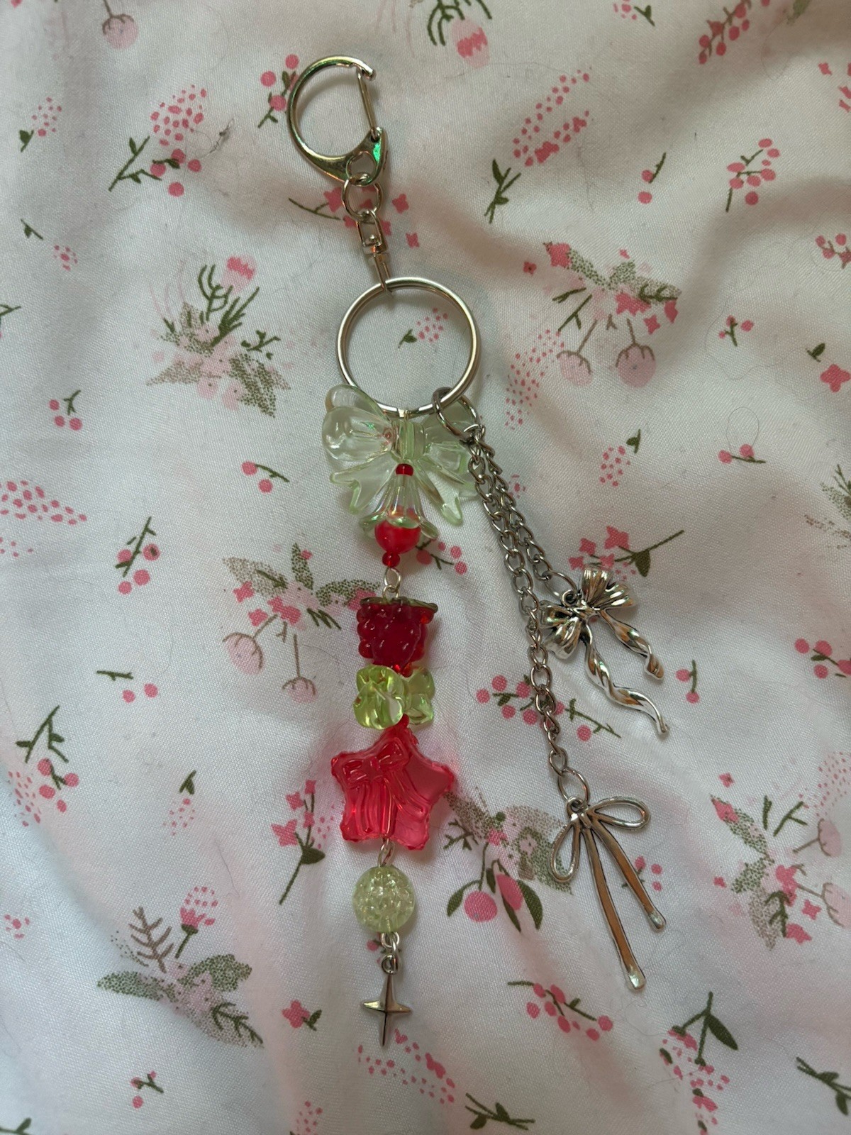 Handmade raspberry themed acrylic beaded with silver bow accented keychain