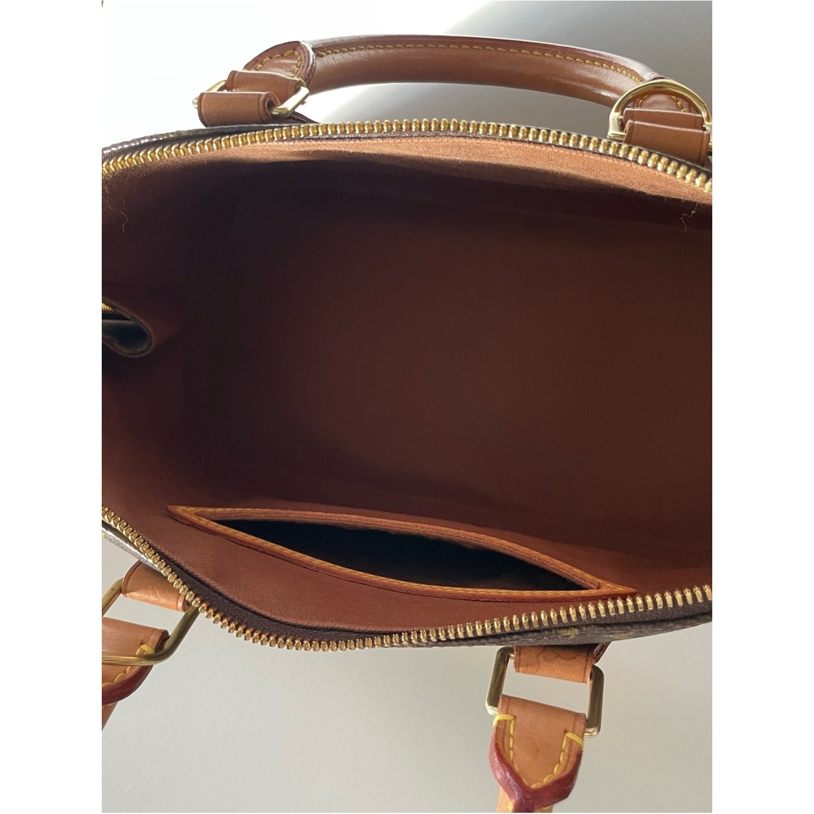 Authentic Louis Vuitton Alma PM handbag in classic Monogram canvas