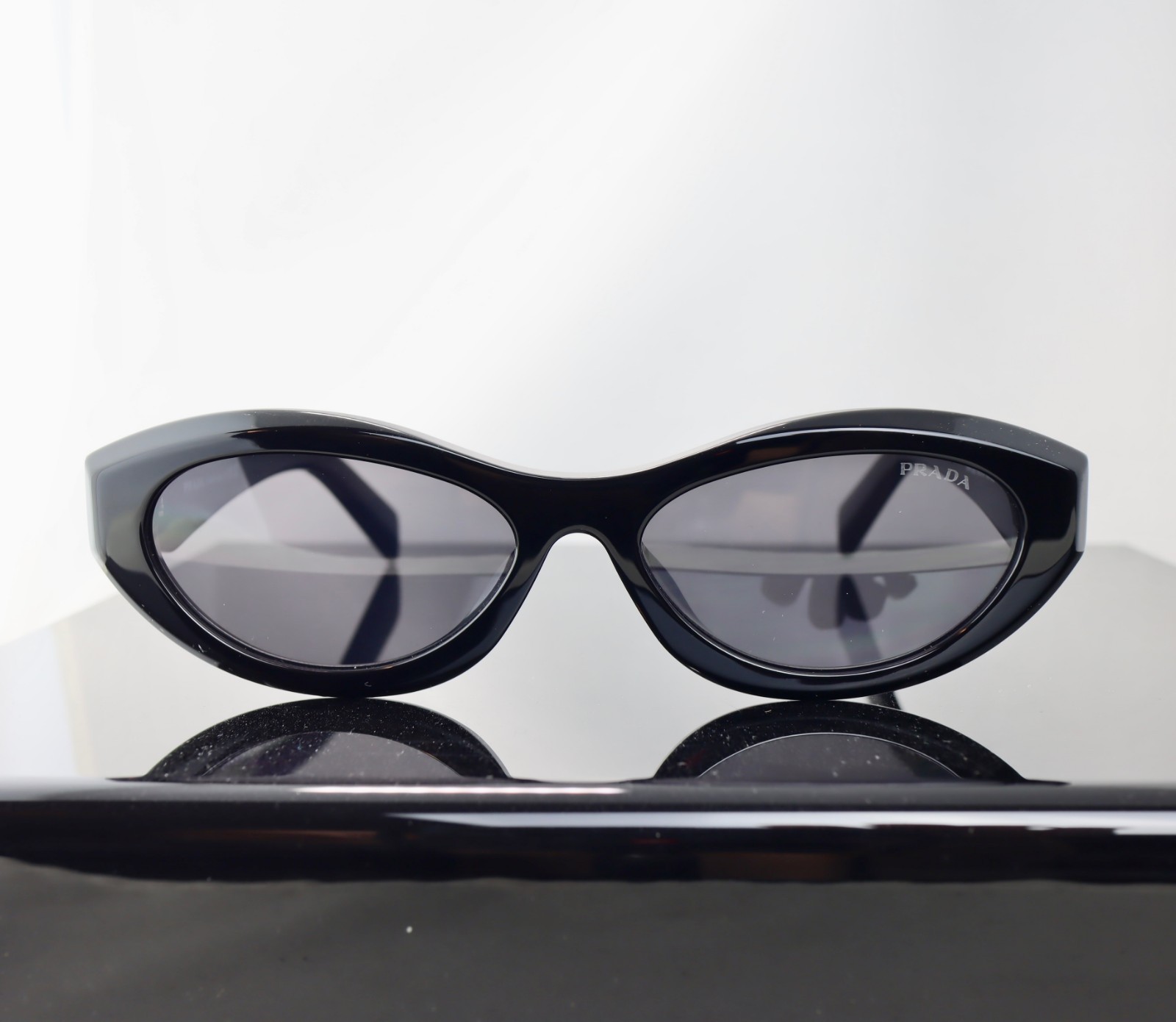 Prada PR26ZS Black / Gray Lens Oval Sunglasses 100% UV