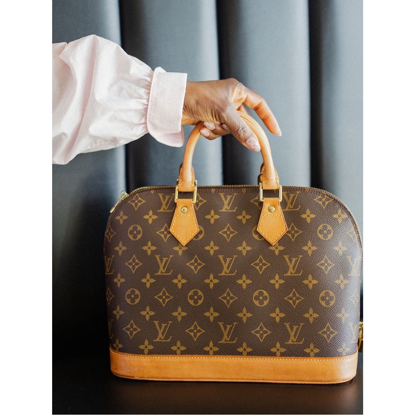 Authentic Louis Vuitton Alma PM handbag in classic Monogram canvas