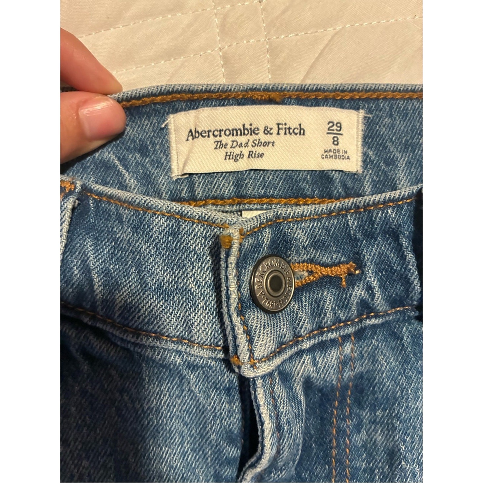Abercrombie & Fitch “The Dad Short” in a high-rise fit with a raw hem 29/8