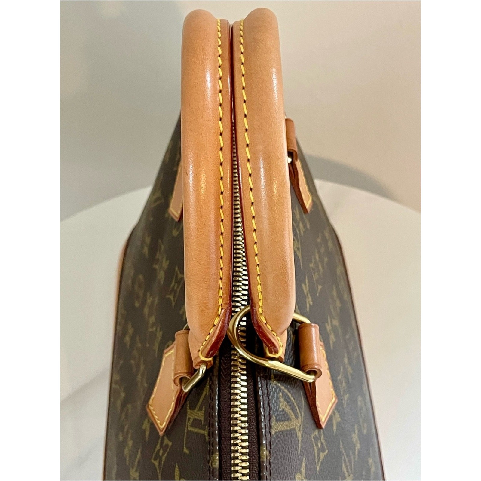 Authentic Louis Vuitton Alma PM handbag in classic Monogram canvas
