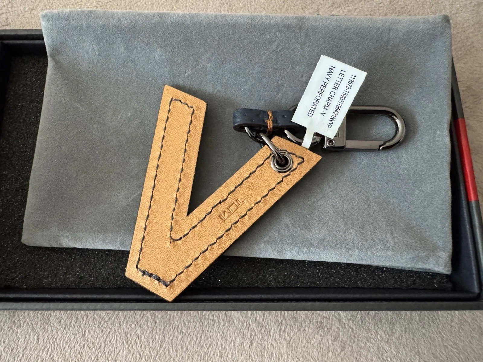 Tumi letter Charm “V”