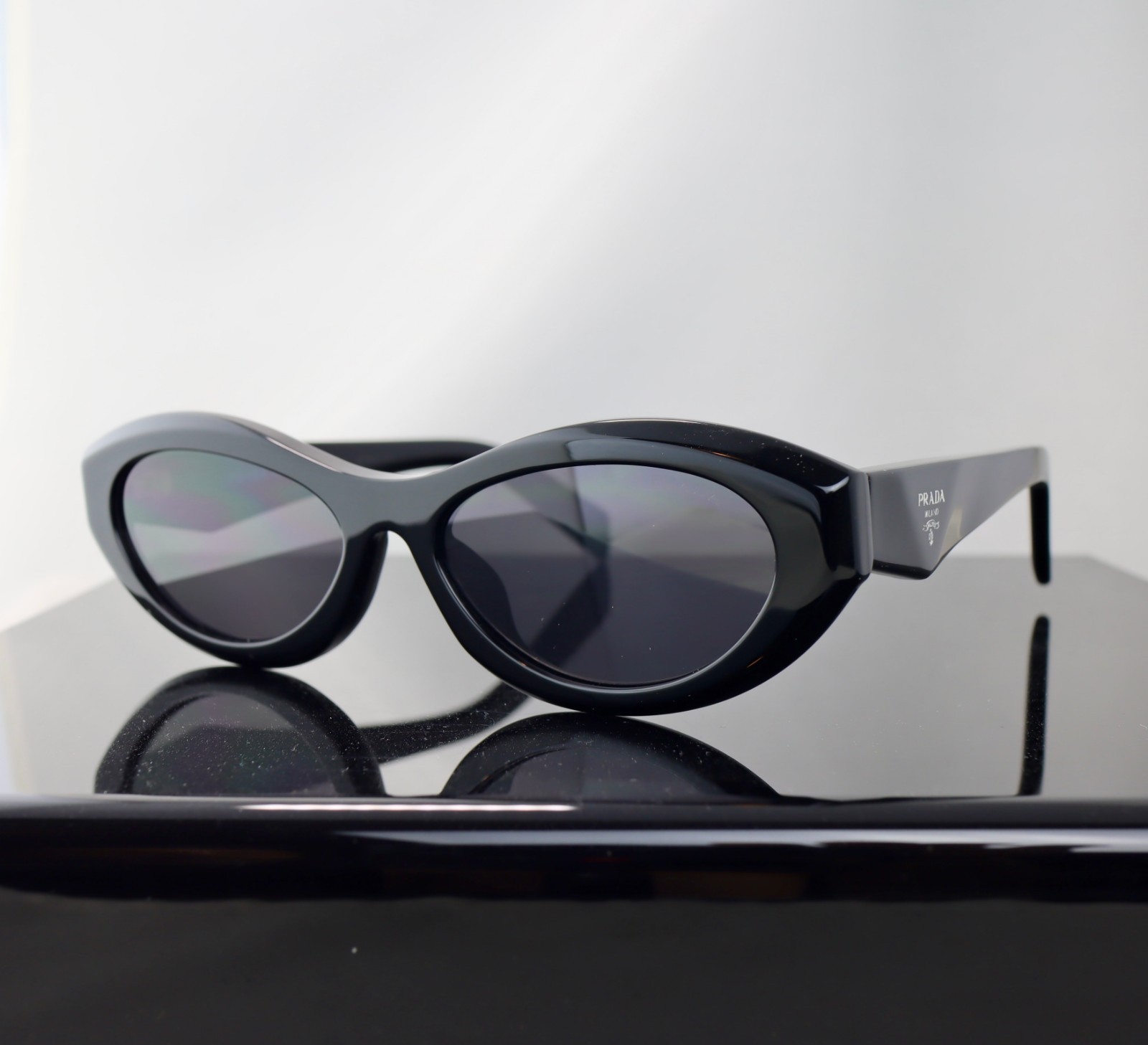 Prada PR26ZS Black / Gray Lens Oval Sunglasses 100% UV