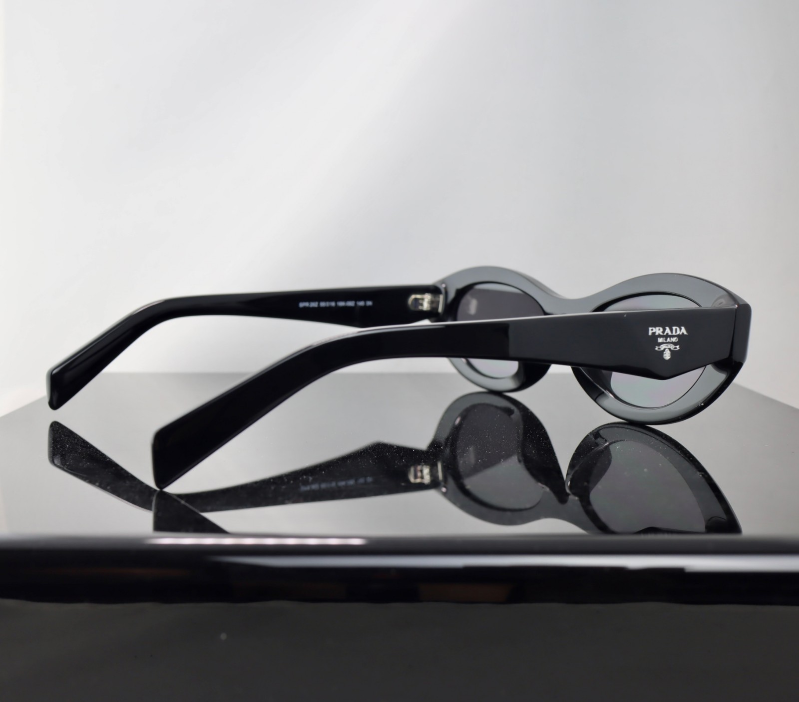 Prada PR26ZS Black / Gray Lens Oval Sunglasses 100% UV