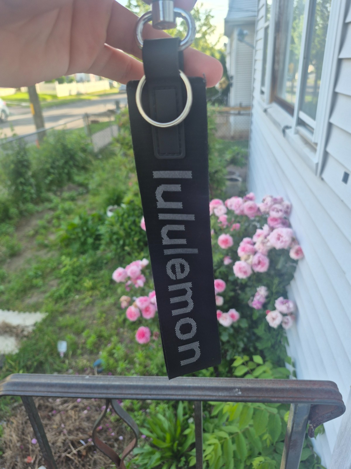 Black lululemon keychain with sliver clasp with Grey letters