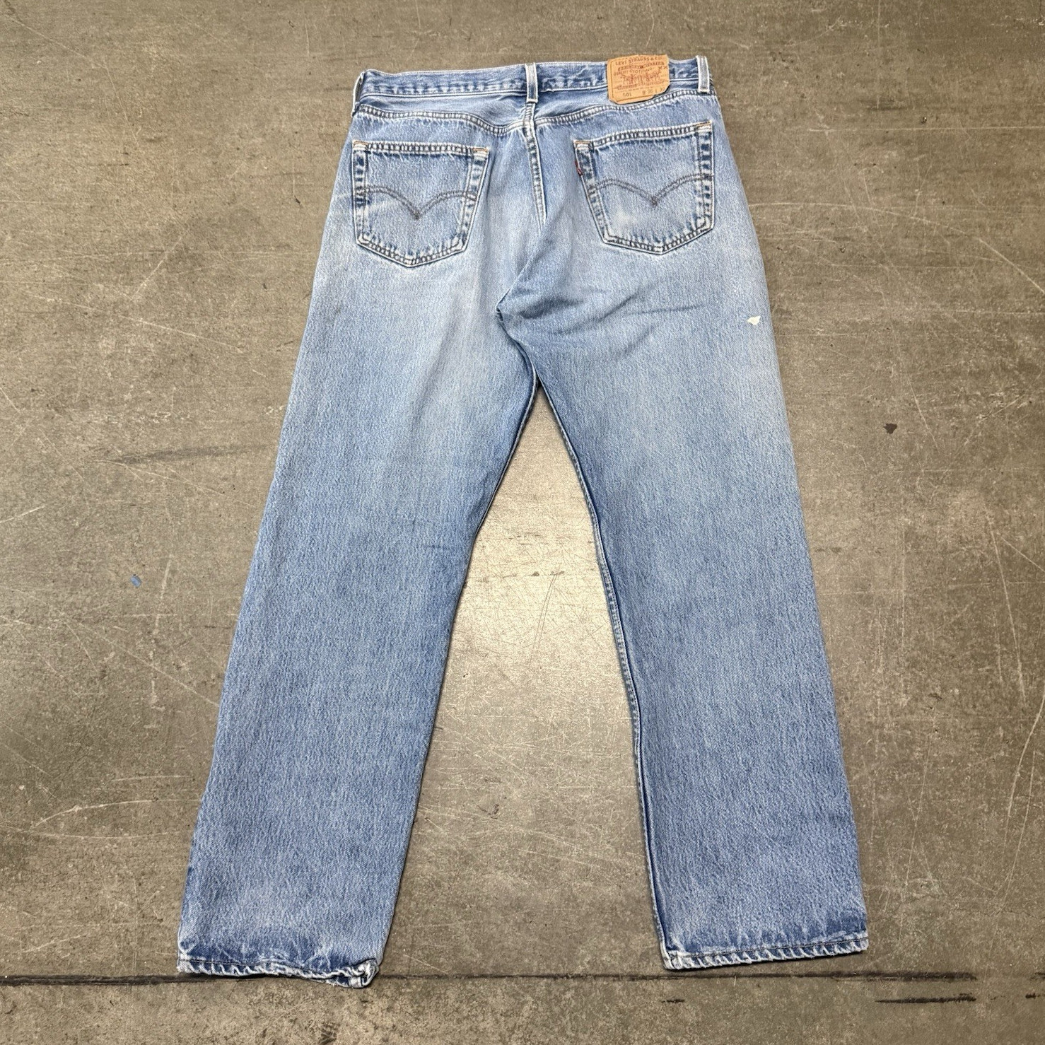 VINTAGE 90s Levi’s 501 Series button fly light wash straight jeans distressed