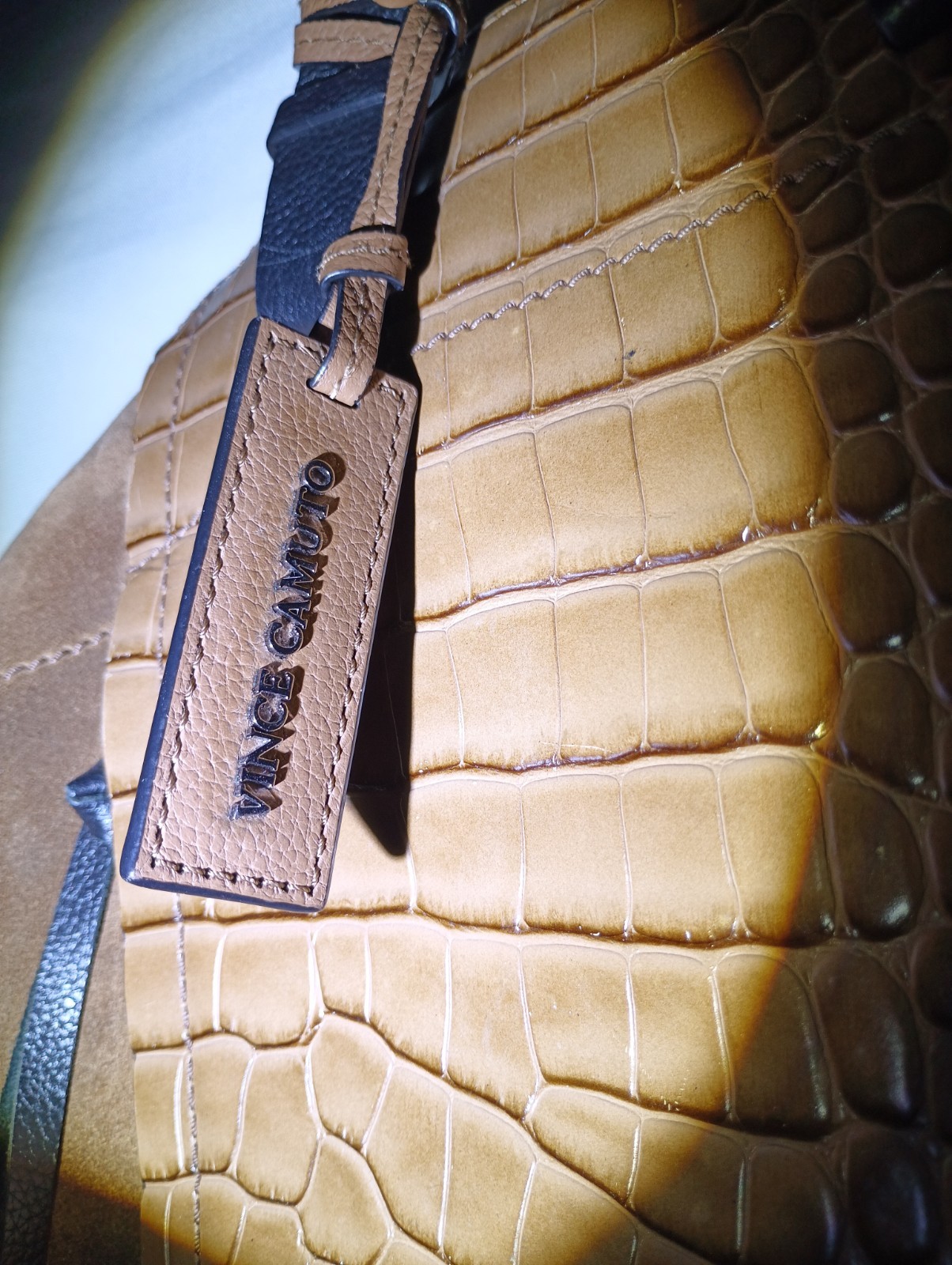 Vince Camuto bag with a suede body and a crocodile-embossed leather panel.