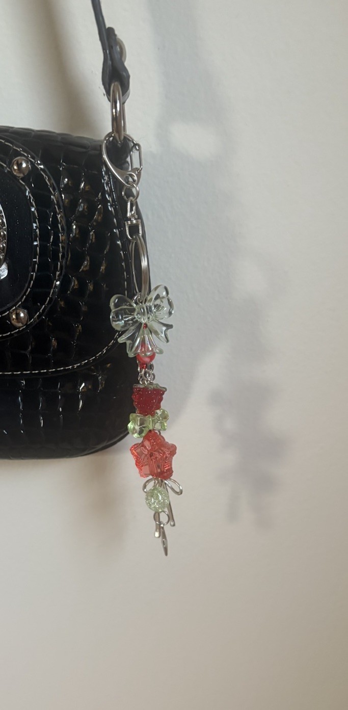 Handmade raspberry themed acrylic beaded with silver bow accented keychain